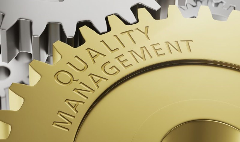 Quality Management gold cog graphic 